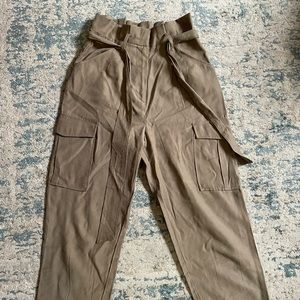 H&M green high rise paper bag pants (shows ankles)
